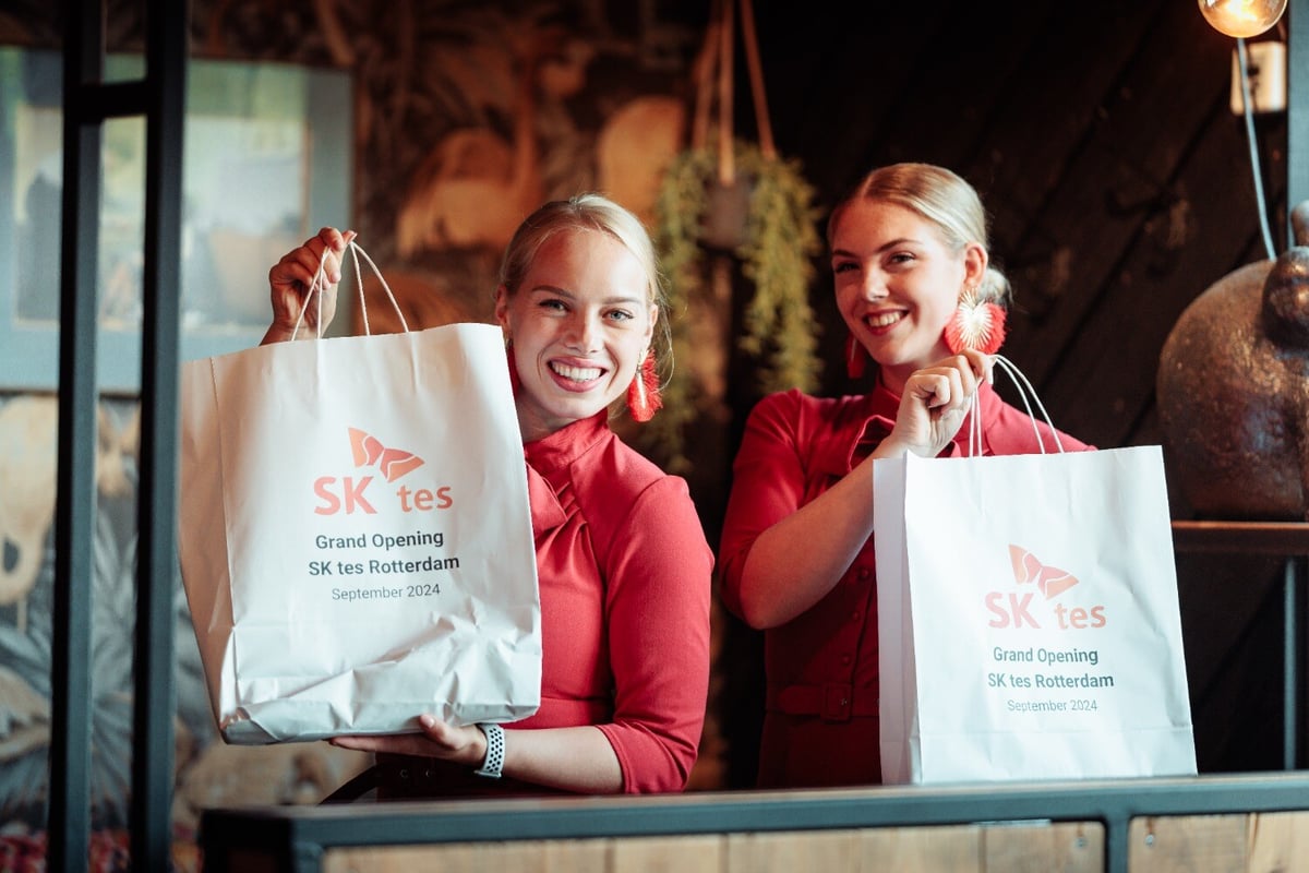 Event hosts show SK tes gift bags for attendees